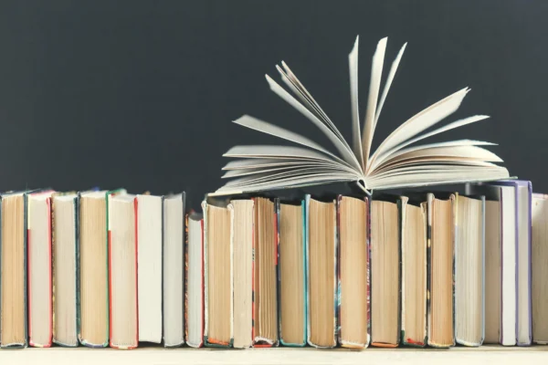 Books line up open pages