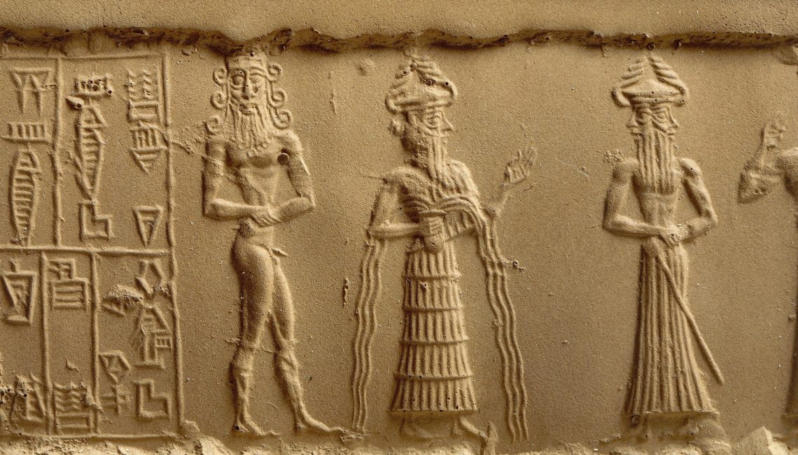 clay-impression-of-a-cylinder-seal-depicting-adoration-scene-fro